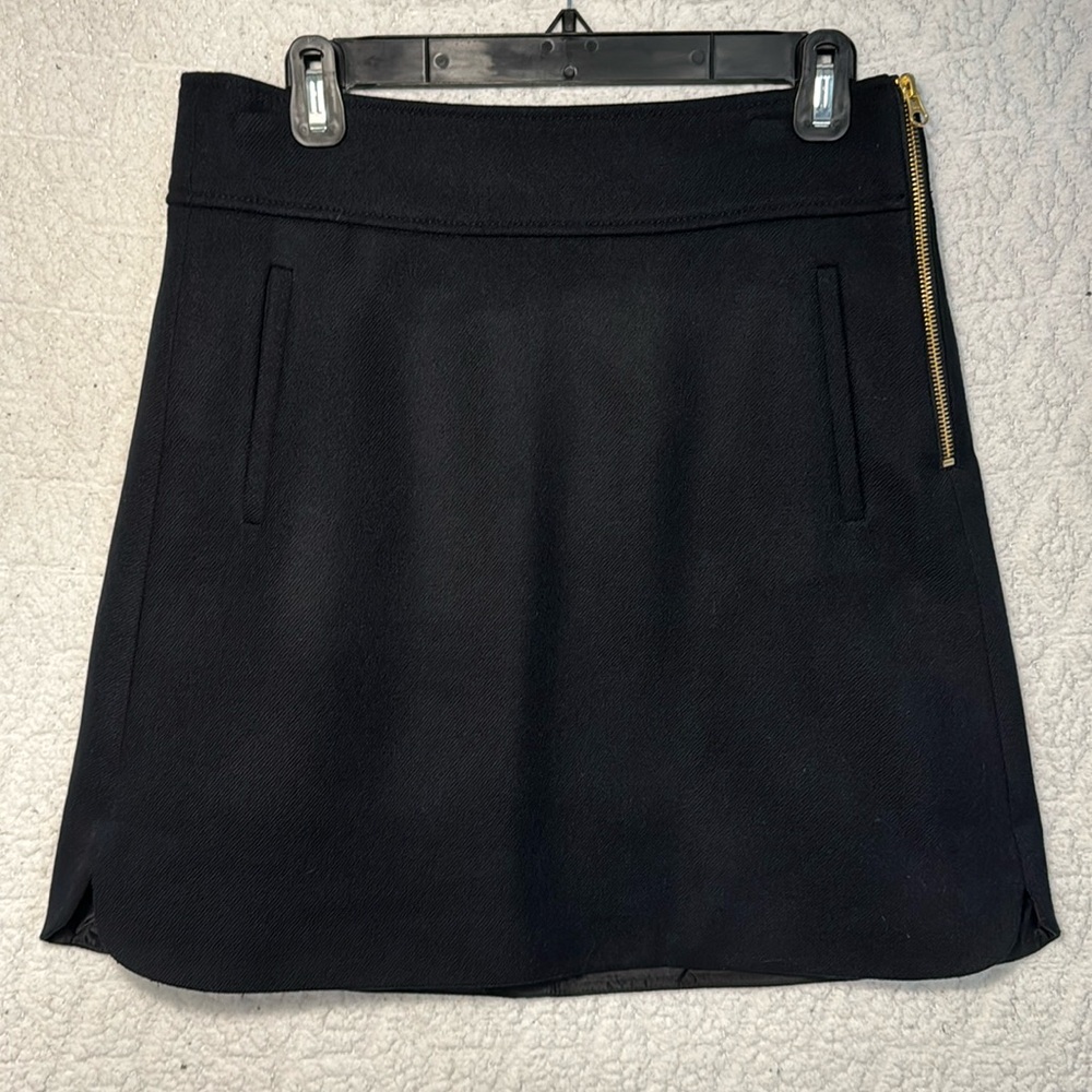 J Crew 100% wool black skirt with gold zipper detail and pockets! Size 6T